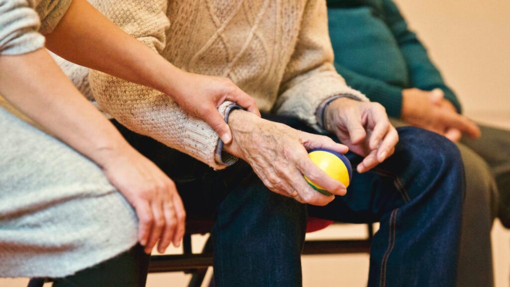 Person Holding a Stress Ball with nurse